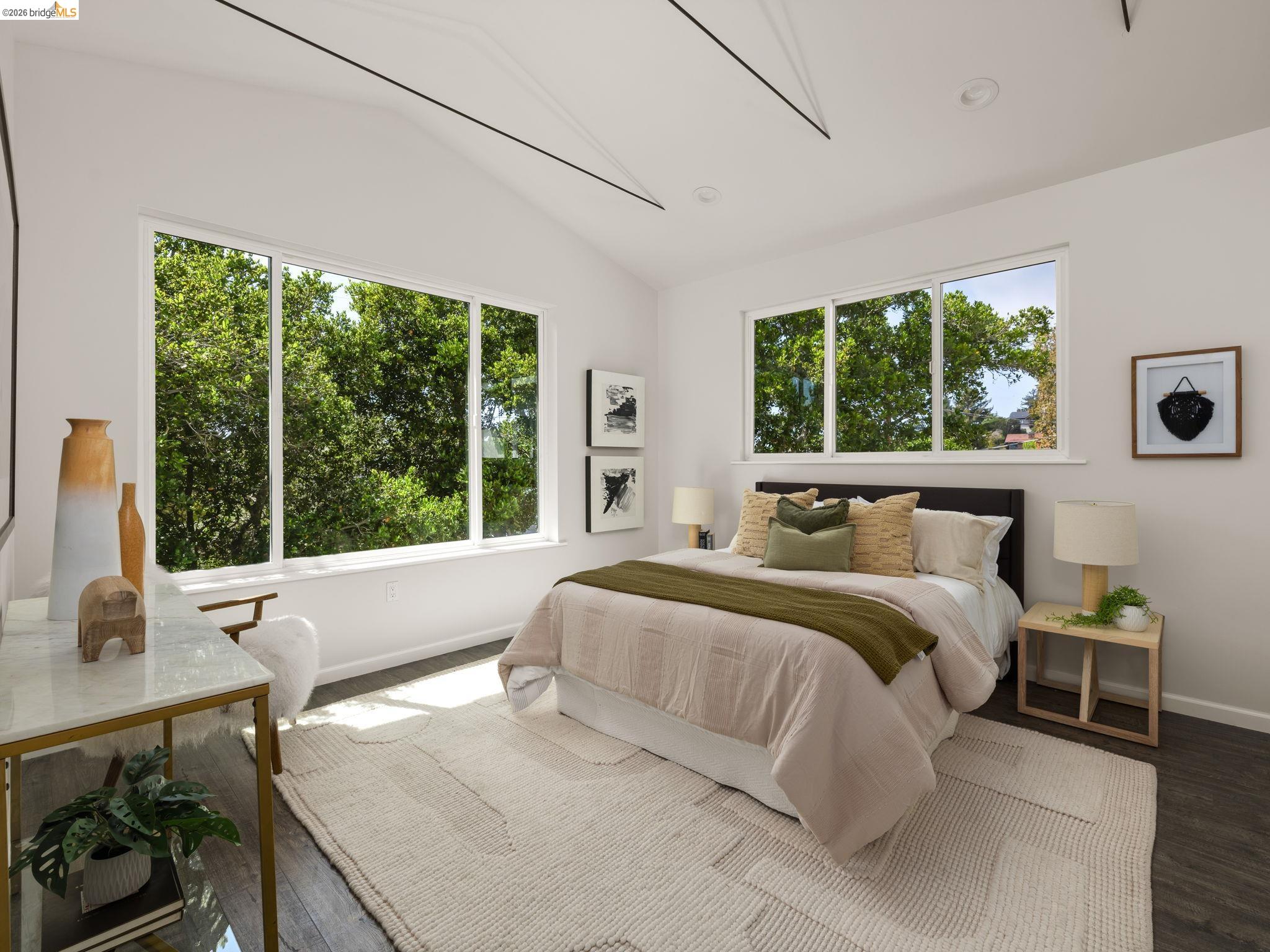 1471 Scenic Avenue Berkeley, CA 94708 - Photo 33 of 42 a large bed sitting in a bedroom next to a window