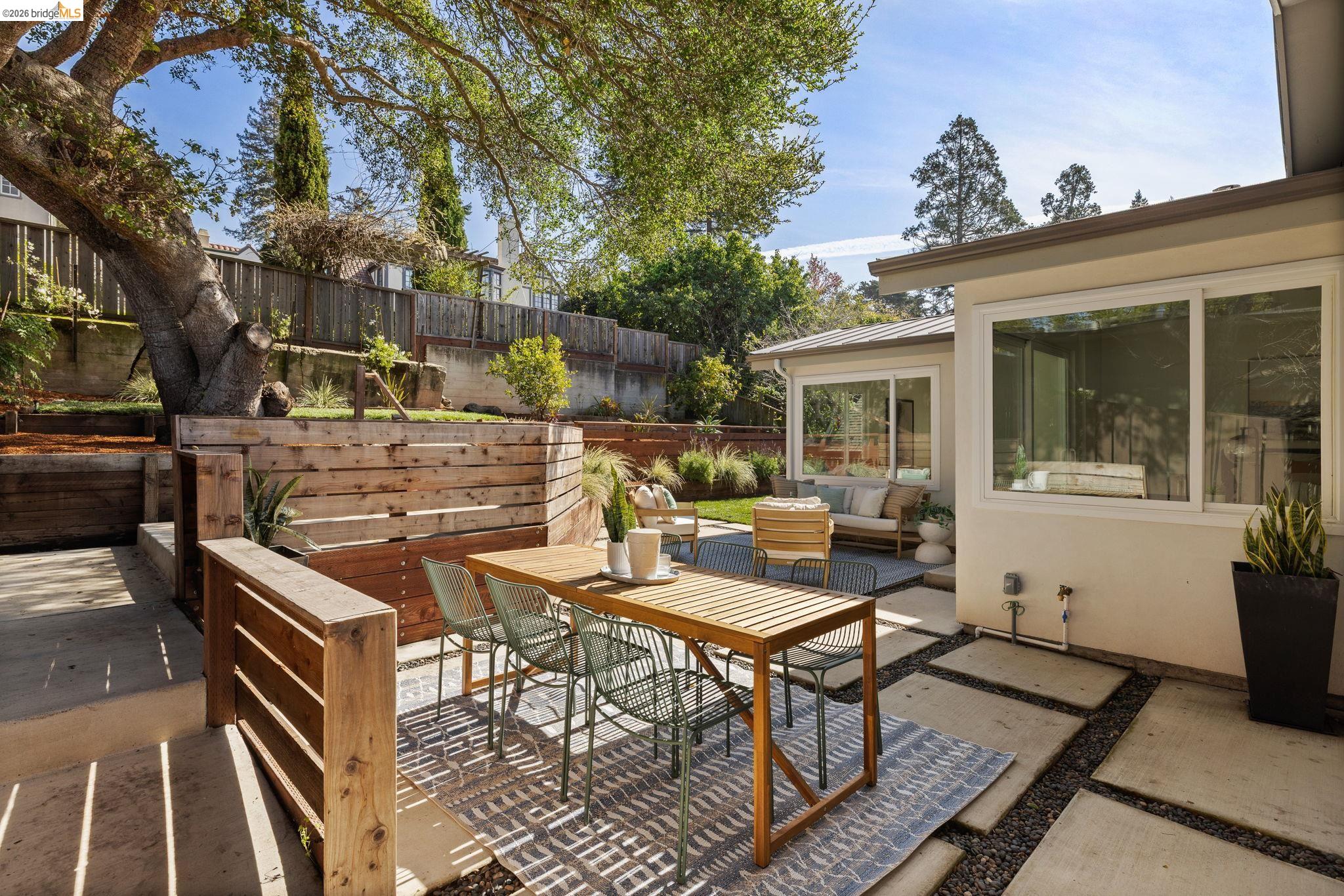 1471 Scenic Avenue Berkeley, CA 94708 - Photo 35 of 42 a view of a patio with table and chairs and potted plants