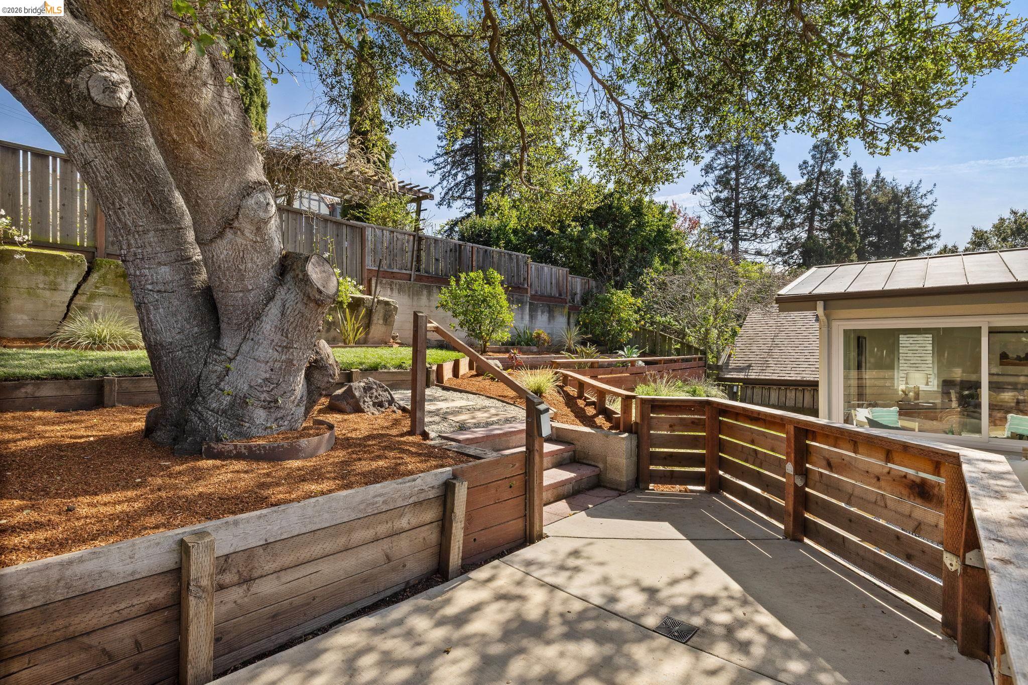 1471 Scenic Avenue Berkeley, CA 94708 - Photo 39 of 42 a view of a roof deck with couches and wooden fence