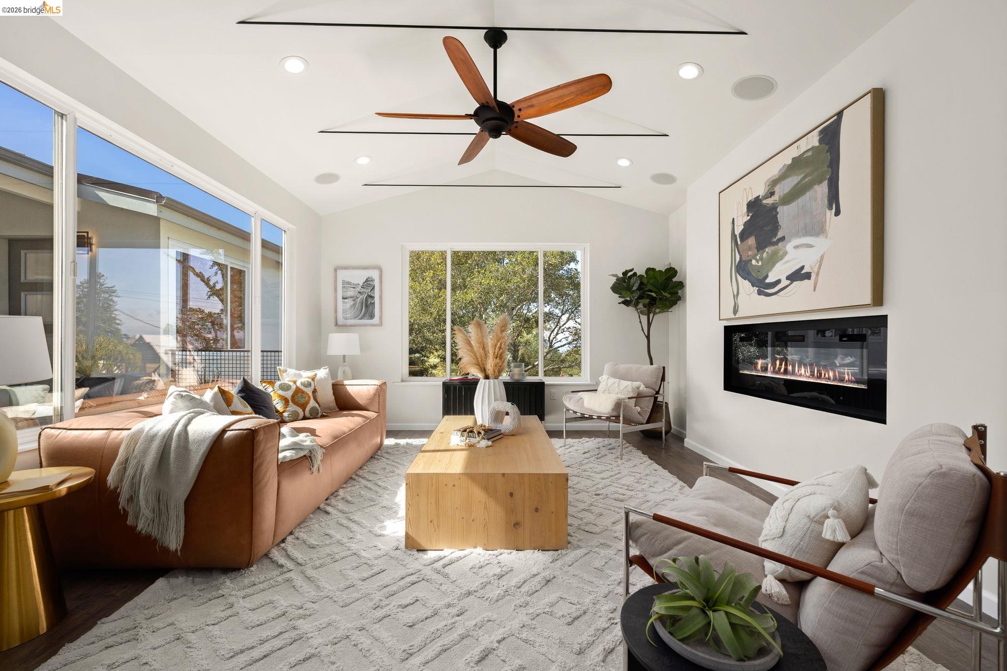 1471 Scenic Avenue Berkeley, CA 94708 - Photo 6 of 42 a living room with furniture ceiling fan and a large window