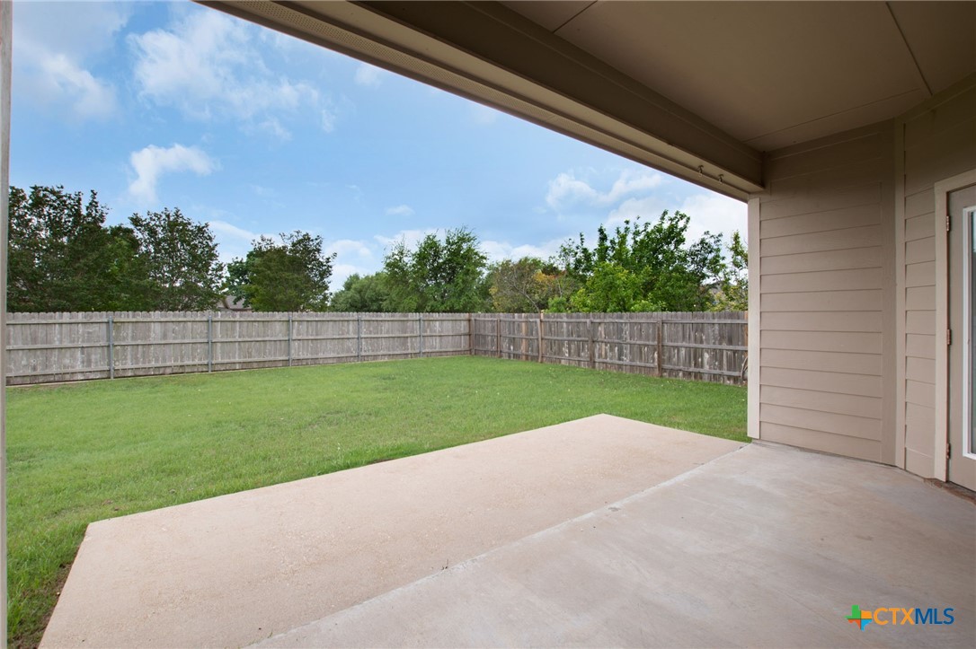 408 Copper Ridge Loop Temple, TX 76502 - Photo 4 of 39 Views from the covered patio overlooking the backyard