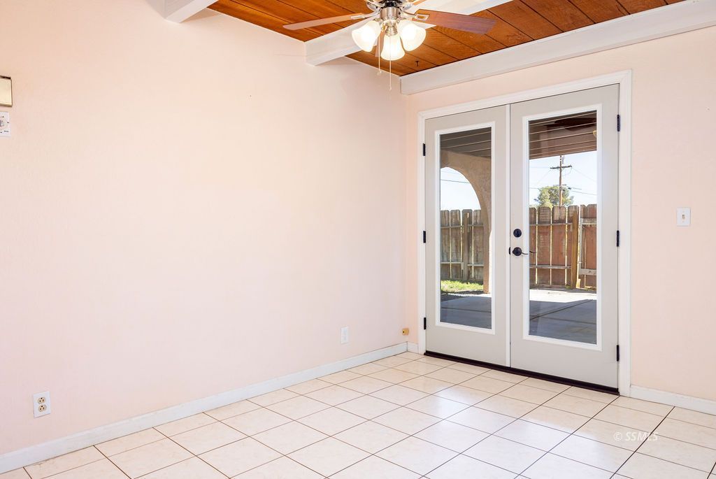 1144 West Benson Avenue Ridgecrest, CA 93555 - Photo 15 of 32 a view of an empty room with a fan