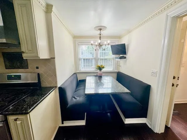 a kitchen with sink and cabinets