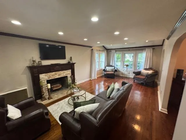 a living room with furniture and a fireplace