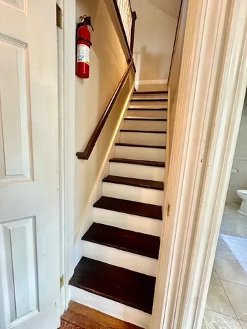a view of entryway with wooden floor and stairs