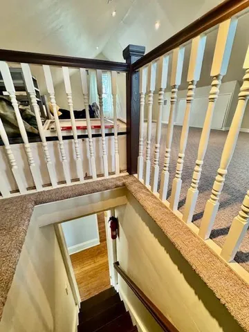 a view of an empty room with stairs