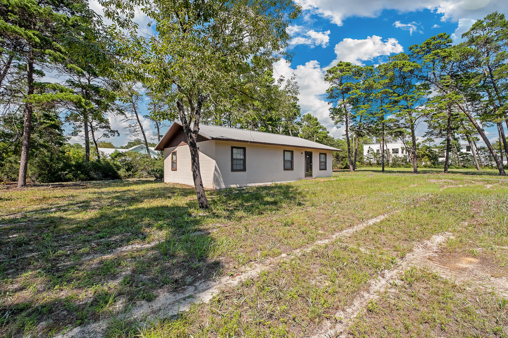 323 Pinewood Lane Inlet Beach, FL 32461 - Photo 1 of 50 a view of a house with a yard