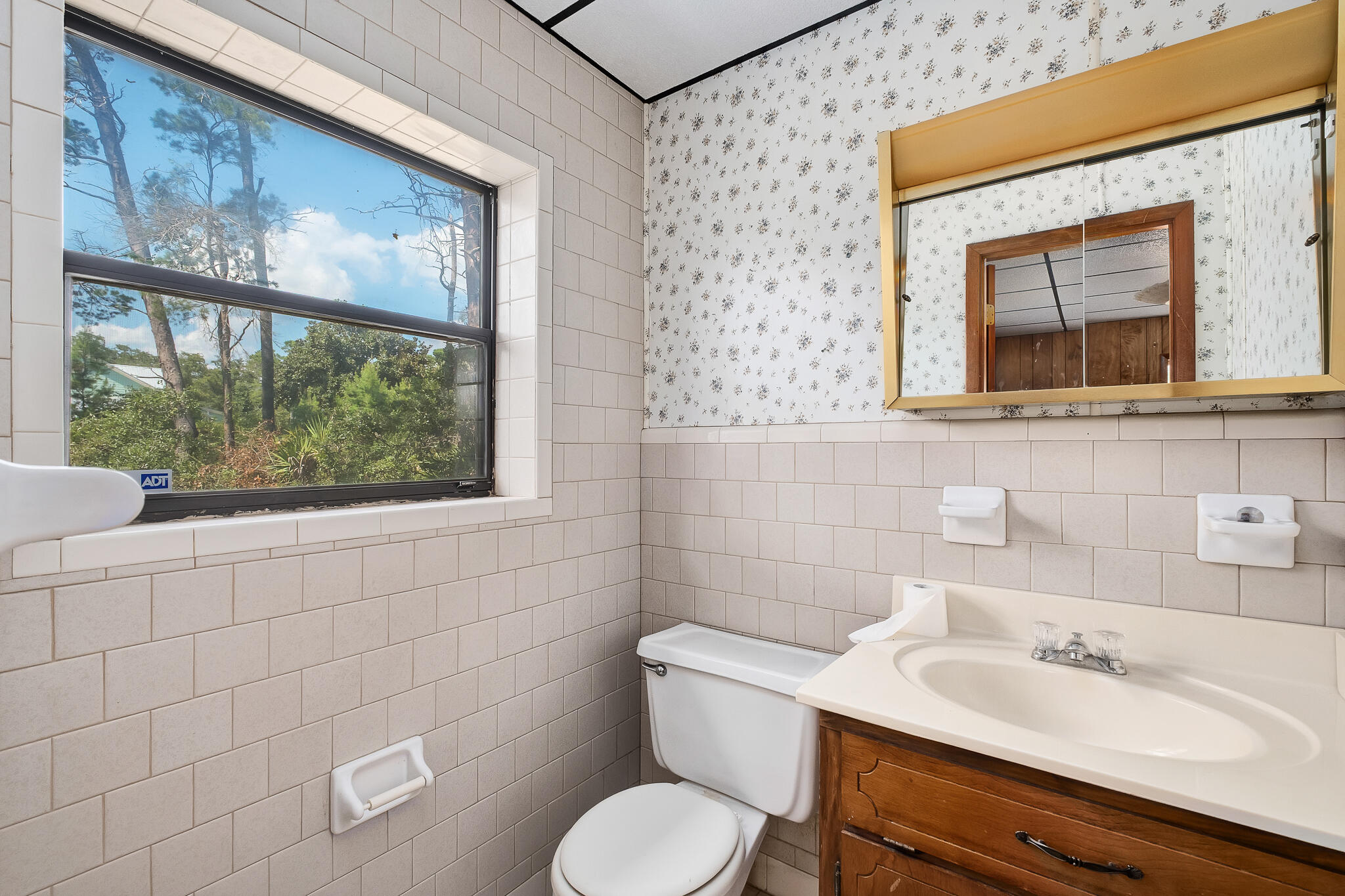 323 Pinewood Lane Inlet Beach, FL 32461 - Photo 12 of 50 a bathroom with a toilet sink and mirror