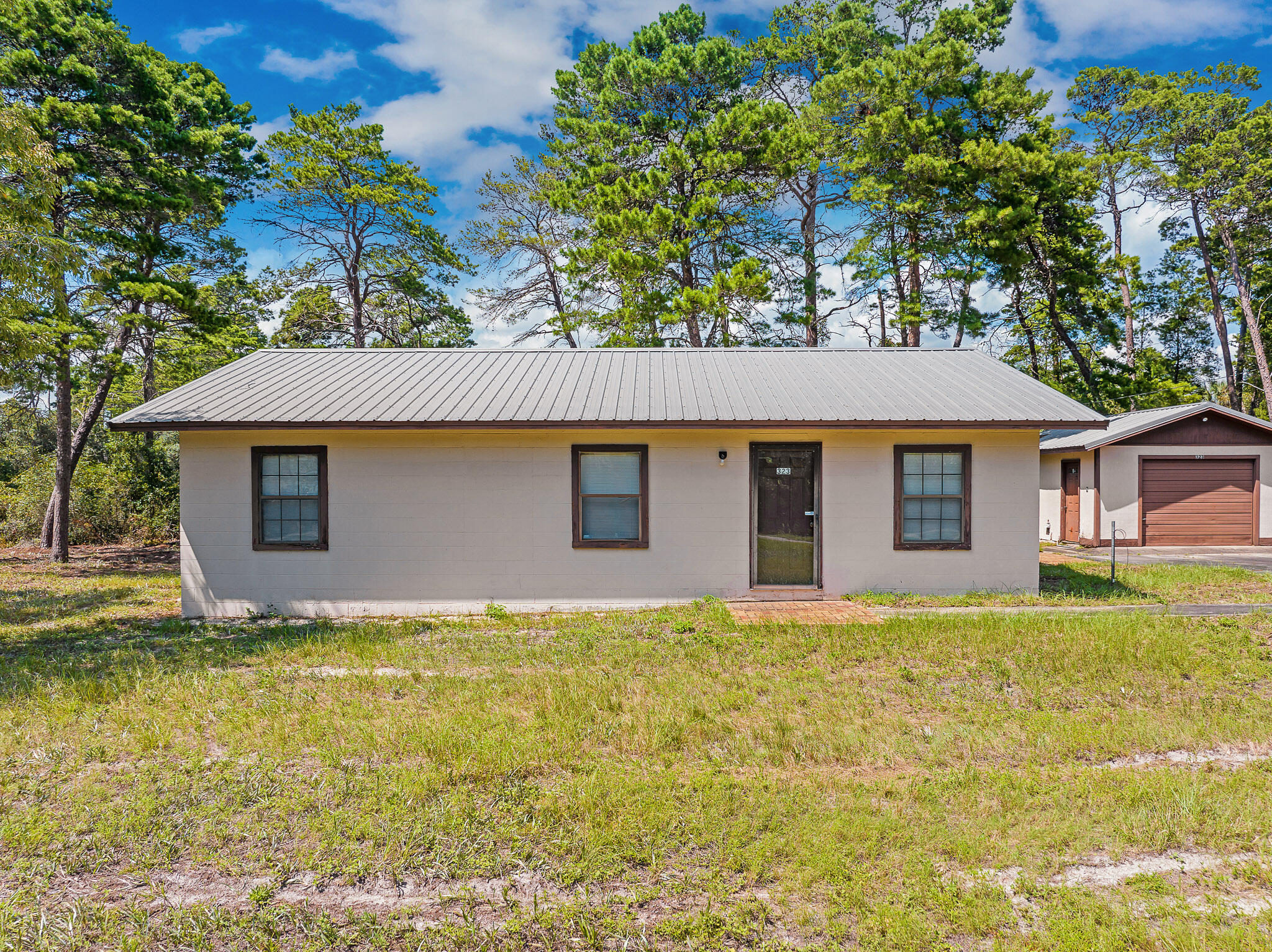 323 Pinewood Lane Inlet Beach, FL 32461 - Photo 17 of 50 a view of front of house with a yard