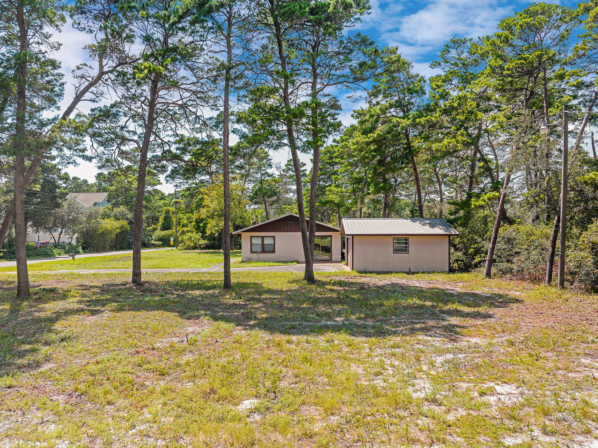 323 Pinewood Lane Inlet Beach, FL 32461 - Photo 20 of 50 a house with trees in front of it