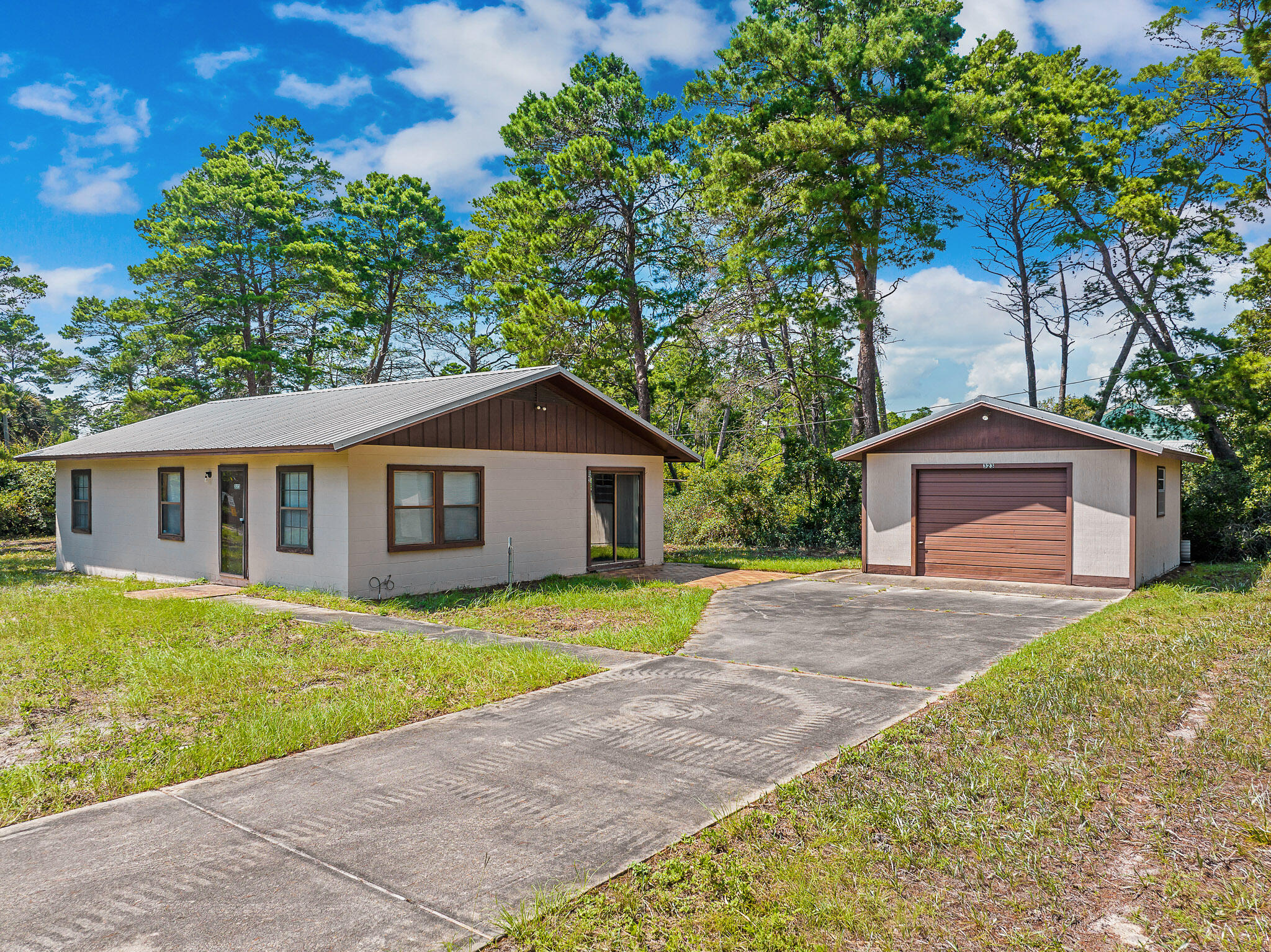 323 Pinewood Lane Inlet Beach, FL 32461 - Photo 21 of 50 a front view of a house with yard