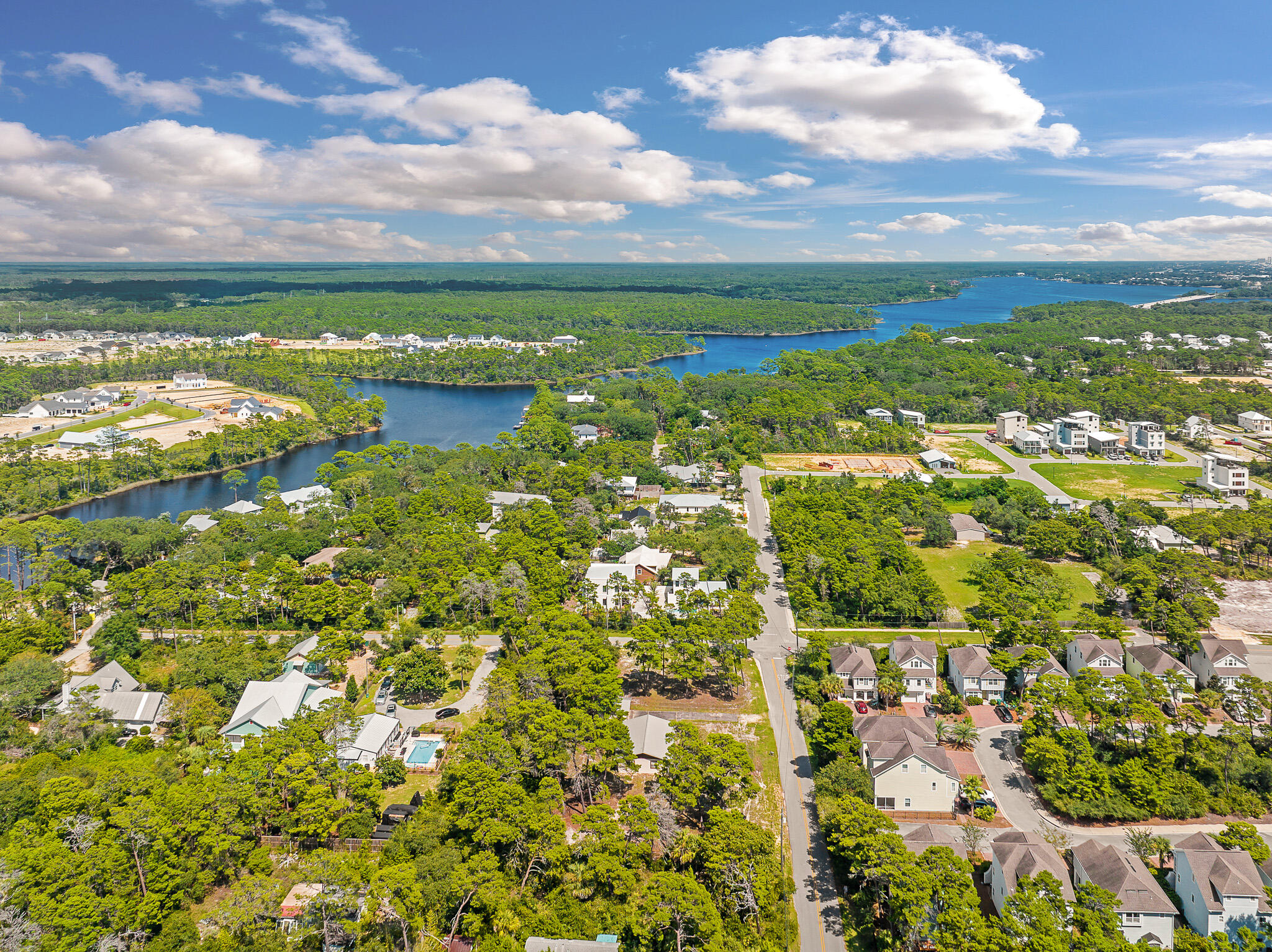 323 Pinewood Lane Inlet Beach, FL 32461 - Photo 33 of 50 a view of a lake with houses in the back