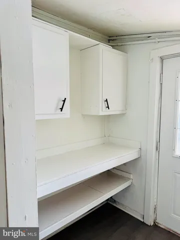 a hallway with cabinets