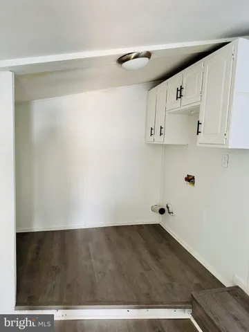 a view of kitchen with cabinets