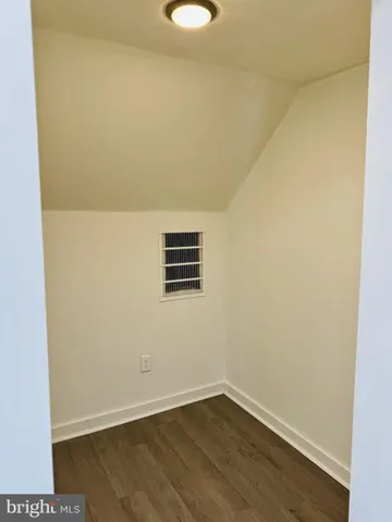 a view of a small space with wooden floor