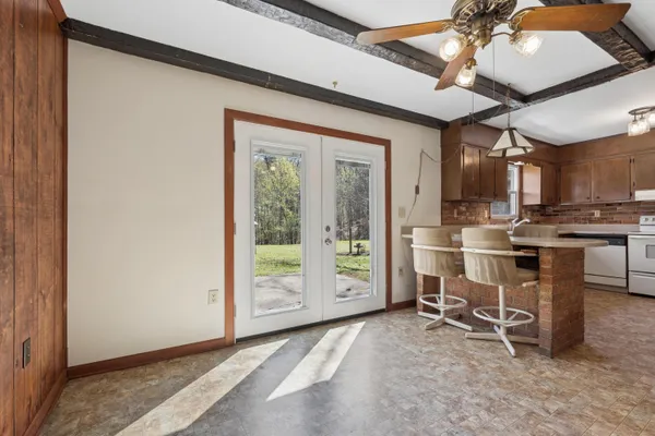 a view of a kitchen with furniture and a window
