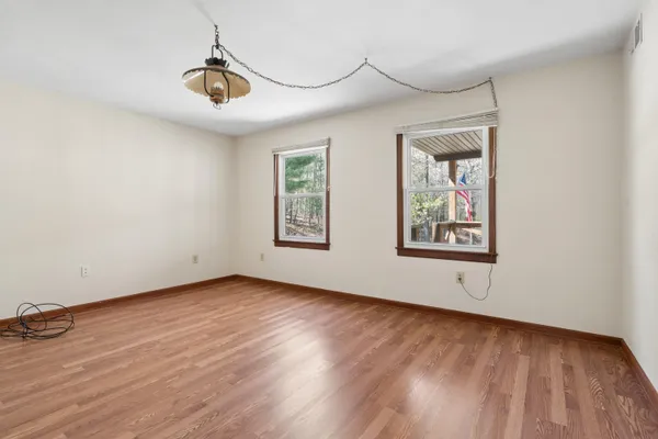 a view of an entryway with wooden floor