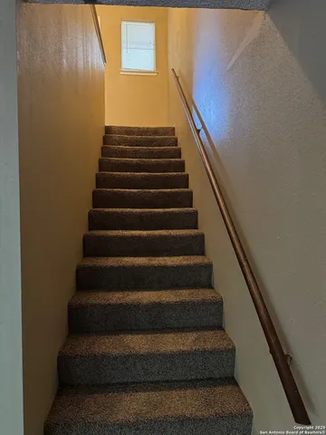 an empty room with a empty space and windows