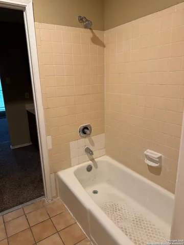 a white toilet sitting next to a sink
