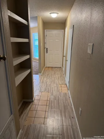 a bathroom with a sink and a window