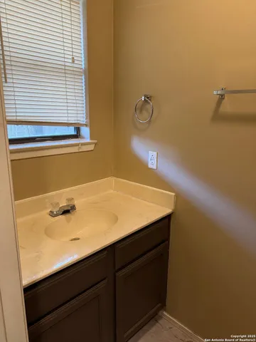 a view of an empty room with windows