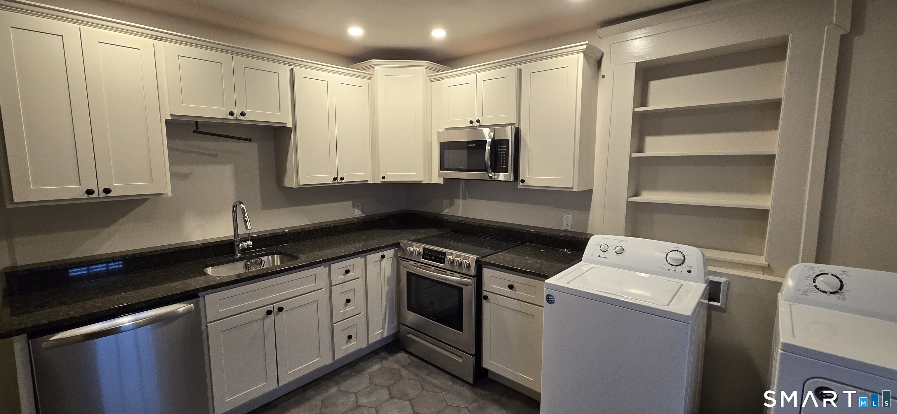 a kitchen with a sink and cabinets