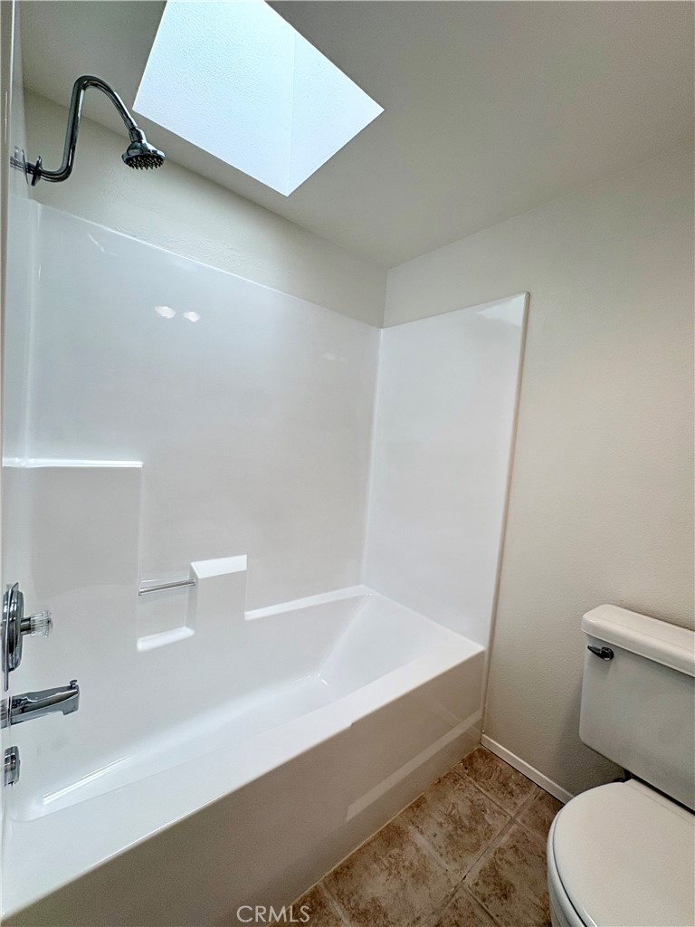 18223 Soledad Canyon Road, Unit 29 Canyon Country, CA 91387 - Photo 16 of 23 a bathroom with a toilet and a tub