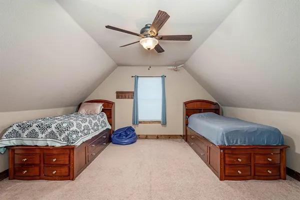 a room with a bed and window