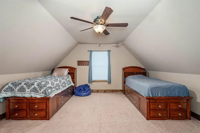 a room with a bed and window