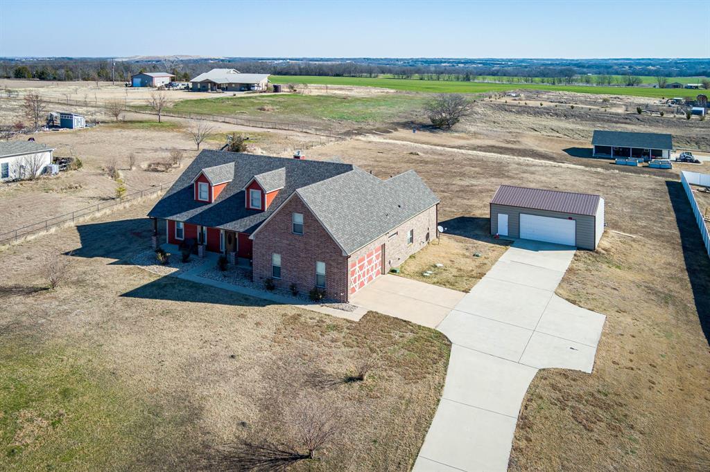 3028 Harrell Road Howe, TX 75459 - Photo 2 of 39 Areial view of the home & outbuilding. Note the concrete extended driveway with thoughtful extension for ease of exiting the oversize attached 2-car garage.