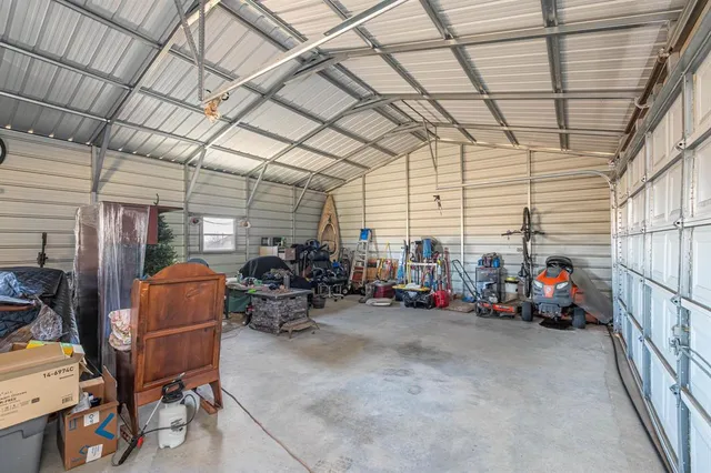a view of a garage with parked cars