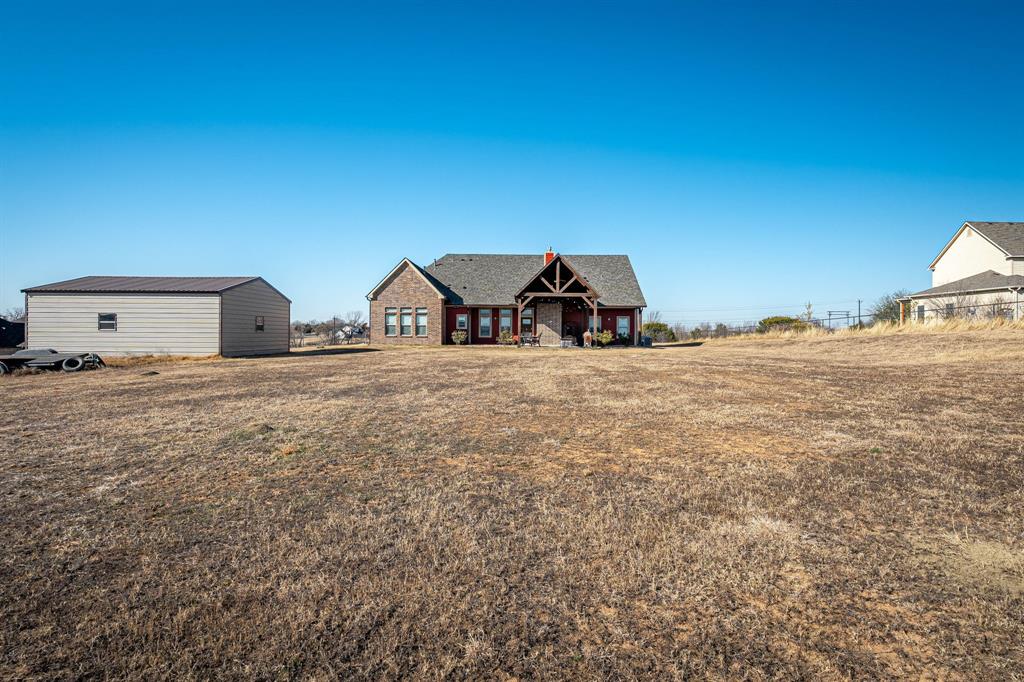 3028 Harrell Road Howe, TX 75459 - Photo 31 of 39 View of the rear of the home and outbuilding f- photo taken from the back of the site.