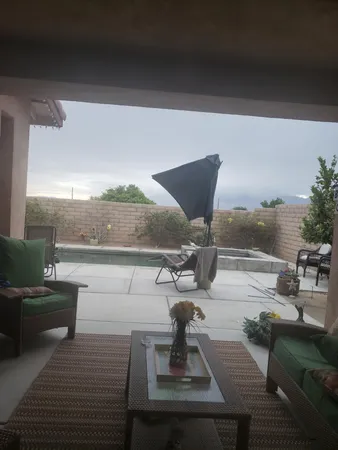 a view of swimming pool with seating area
