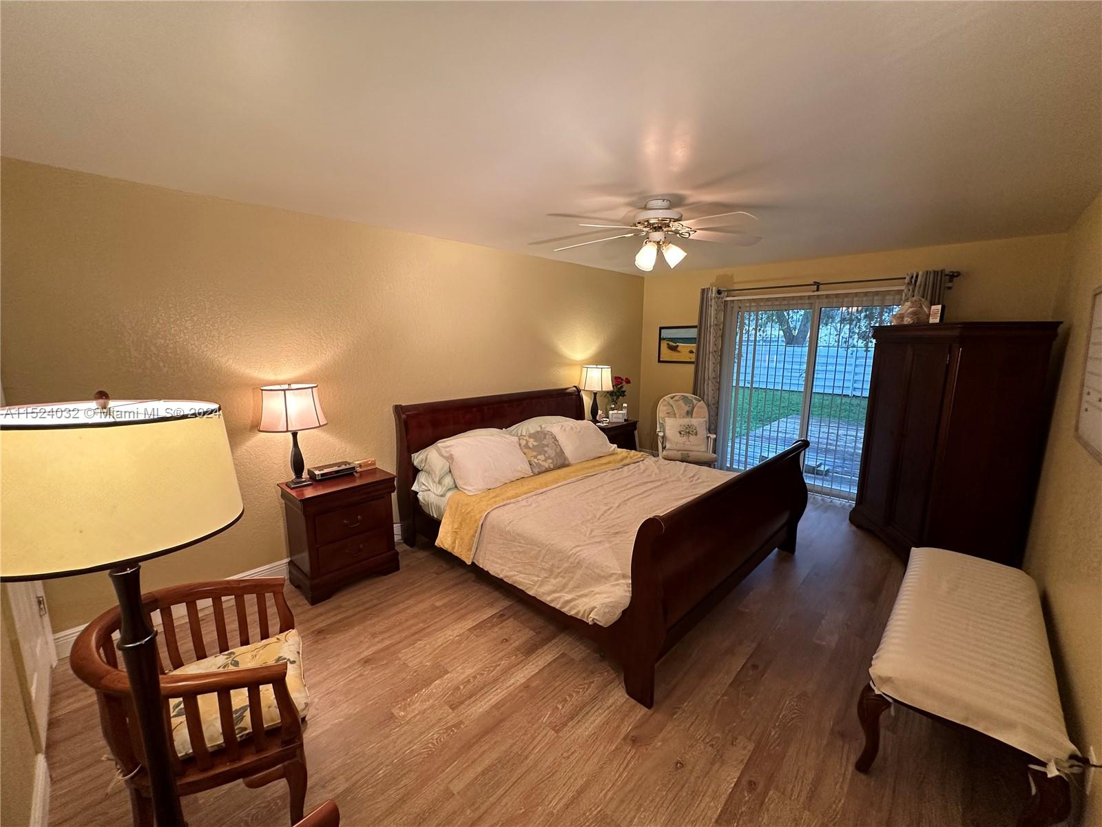 14944 Southwest 144th Court Miami, FL 33186 - Photo 15 of 34 a bed room with a bed window and a chair