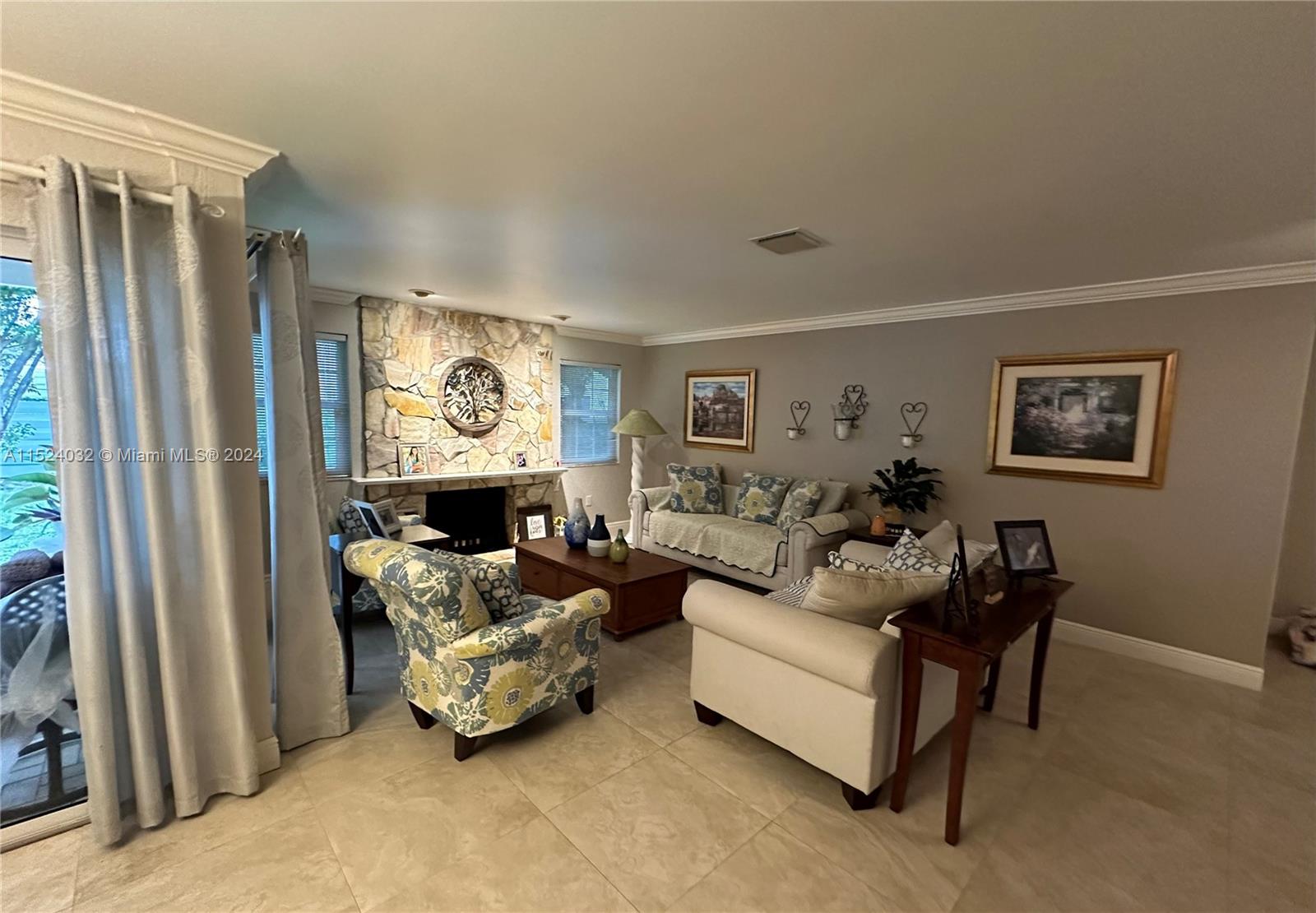 14944 Southwest 144th Court Miami, FL 33186 - Photo 6 of 34 a living room with furniture and a large window