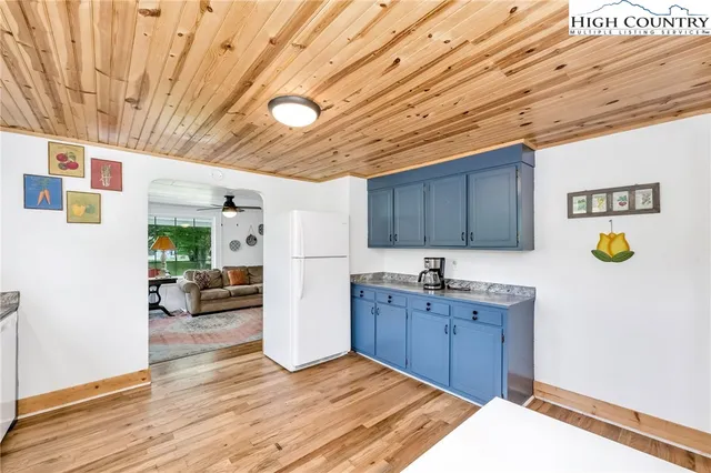 a view of a kitchen with a sink and cabinets