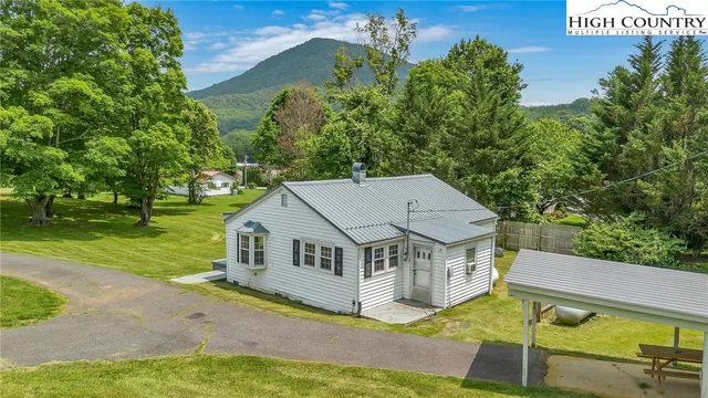 a view of a house with a big yard
