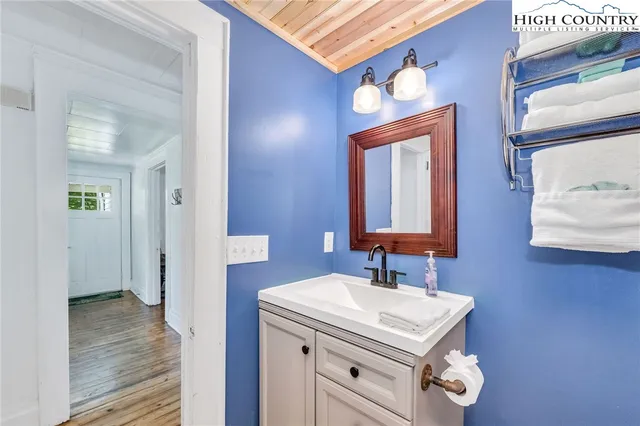 a bathroom with a sink vanity and a mirror