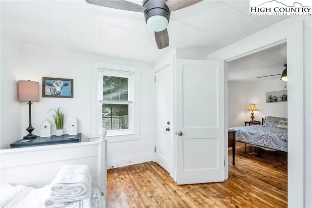 a bedroom with furniture and a window