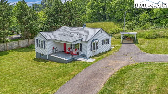 a view of house with yard and entertaining space