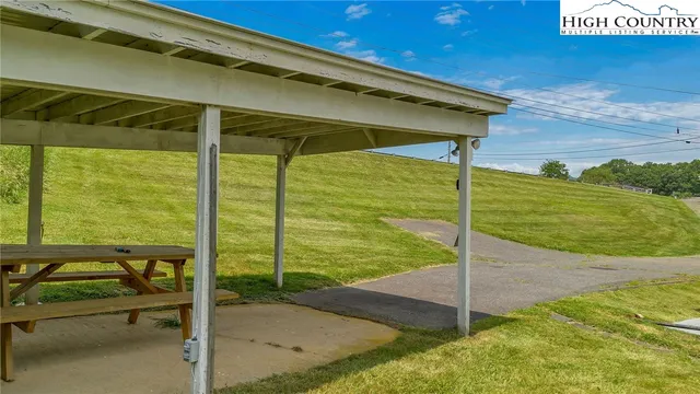 a view of a two chairs in the patio