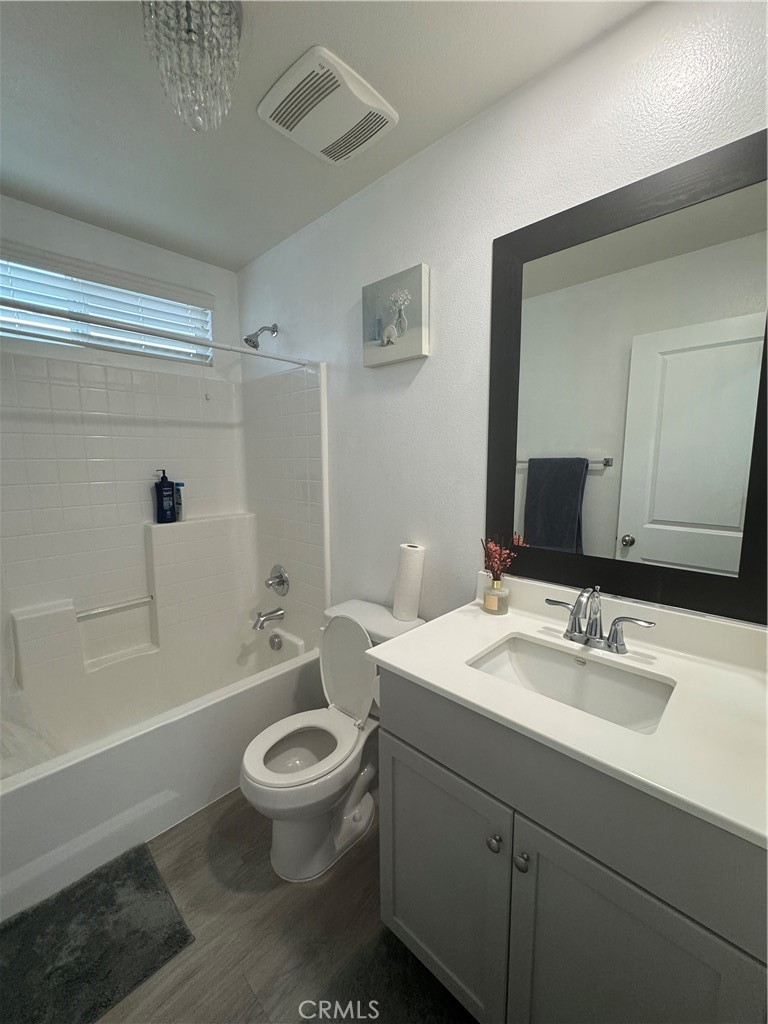 11742 Connell Road Riverside, CA 92505 - Photo 14 of 50 a bathroom with a sink a toilet a mirror and shower