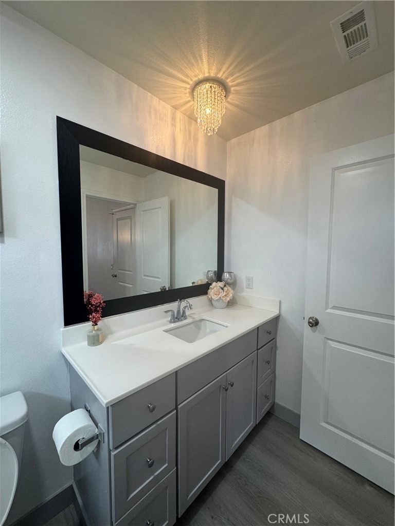 11742 Connell Road Riverside, CA 92505 - Photo 19 of 50 a bathroom with a sink vanity granite and toilet
