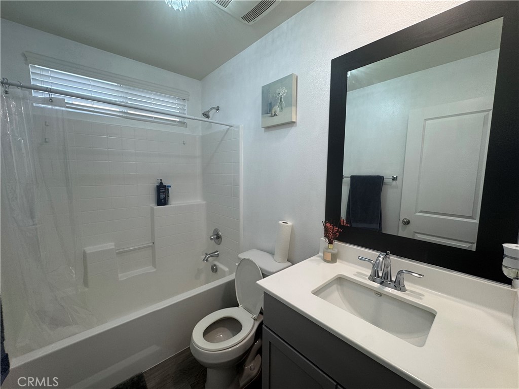 11742 Connell Road Riverside, CA 92505 - Photo 21 of 50 a bathroom with a sink toilet and shower