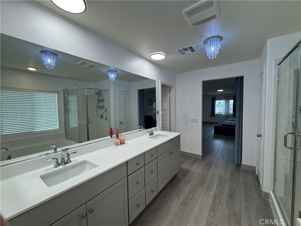 11742 Connell Road Riverside, CA 92505 - Photo 35 of 50 a bathroom with a double vanity sink and a mirror