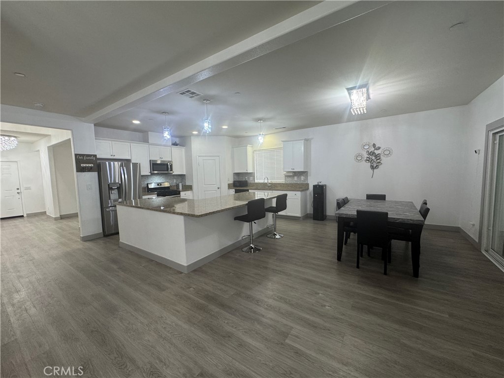 11742 Connell Road Riverside, CA 92505 - Photo 5 of 50 a living room with furniture and kitchen view