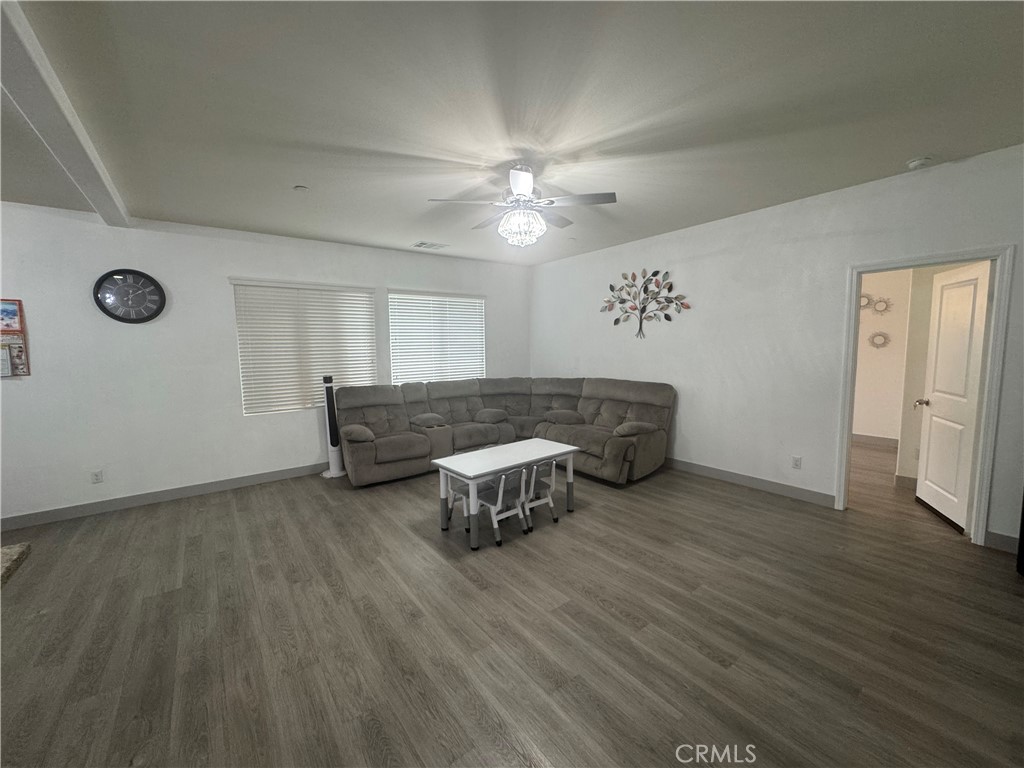 11742 Connell Road Riverside, CA 92505 - Photo 8 of 50 a living room with furniture and a wooden floor