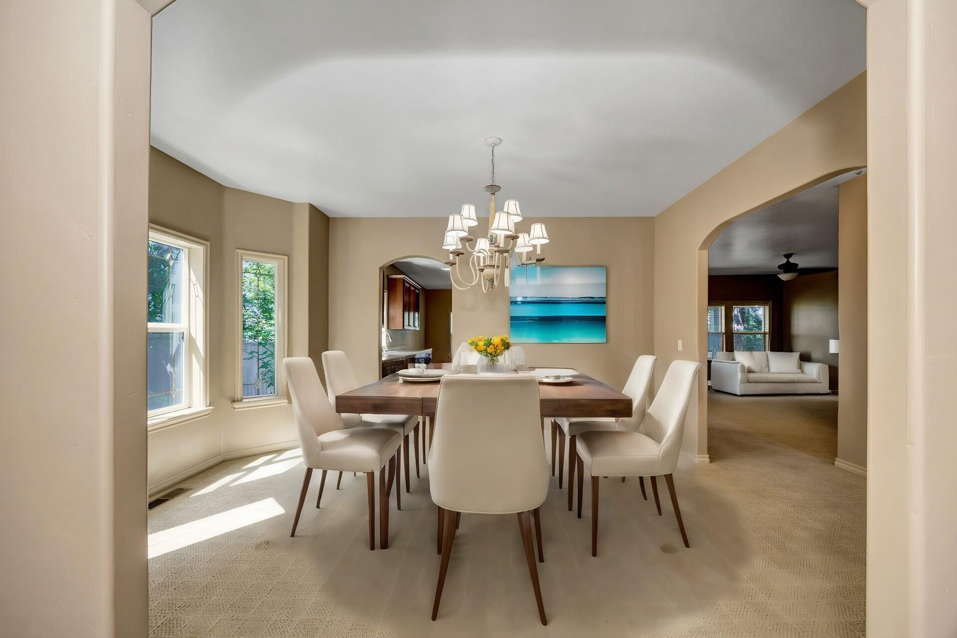 523 Ridgeway Avenue Central Point, OR 97502 - Photo 15 of 68 a view of a dining room with furniture a chandelier and wooden floor