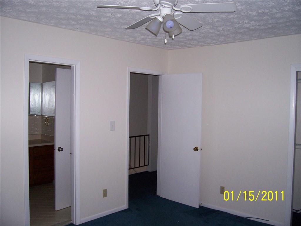 1235 Riverside Drive, Unit H1 Gainesville, GA 30501 - Photo 13 of 19 a view of a hallway with wooden floor
