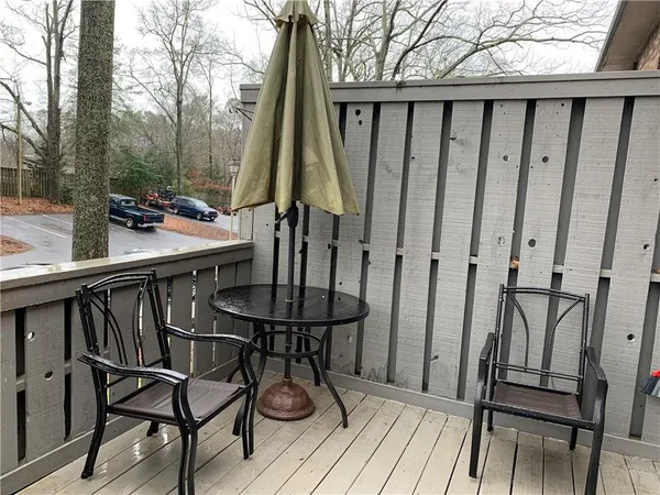 a view of balcony with furniture and wooden floor